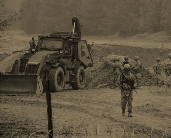 Soldiers near bulldozer