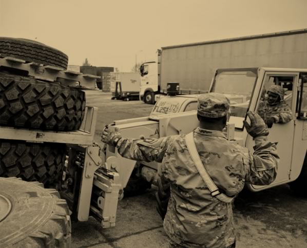 Soldier moving tires